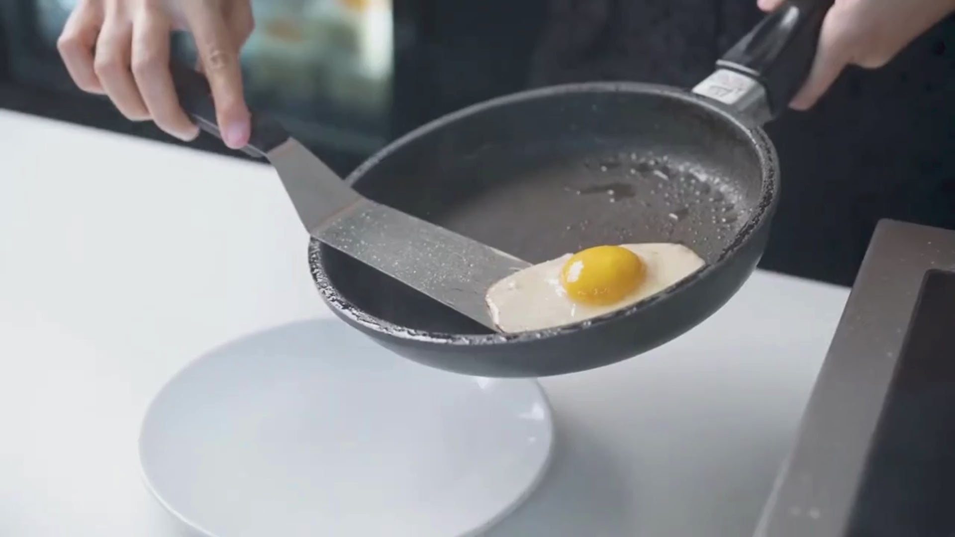 Load video: Vegan plant based eggs frying in pan both sunny side up and poached.